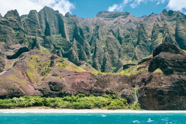 The Kalalau Cathedrals from the water with Waterfall