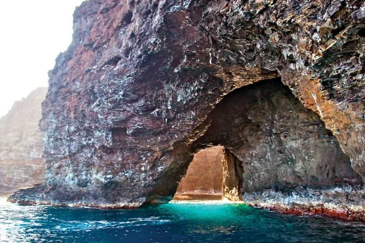 Light Shining through the open ceiling sea cave on Kauai's north shore