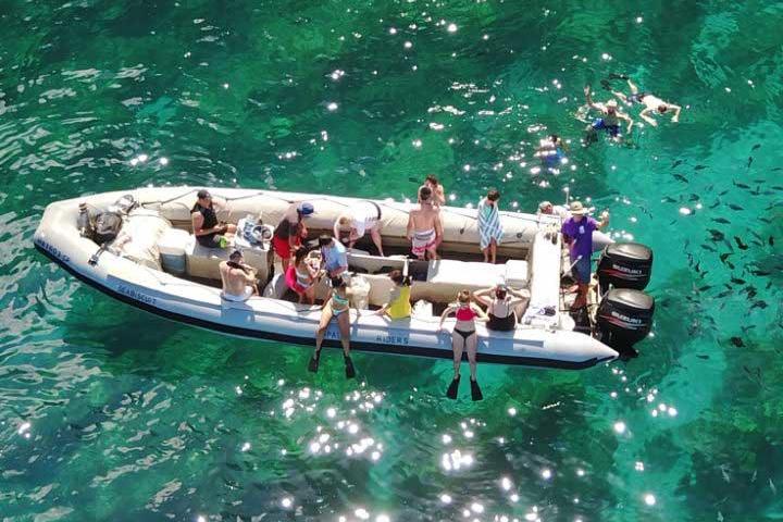 A Group of people on a Na Pali Coast Snorkel tour in Kauai.