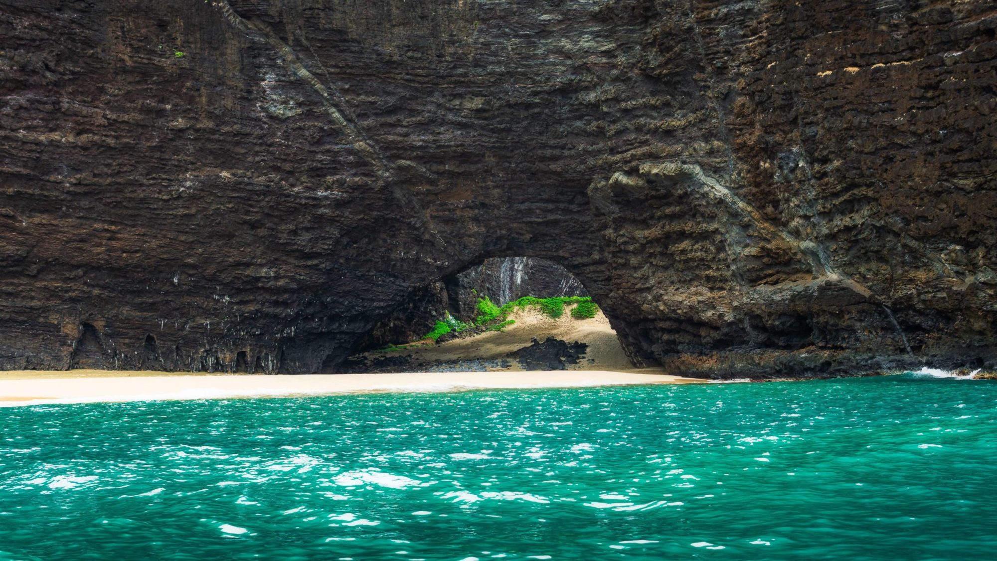 View of the Na Pali Coast's Honopu Sea Arch from a Boat Tour