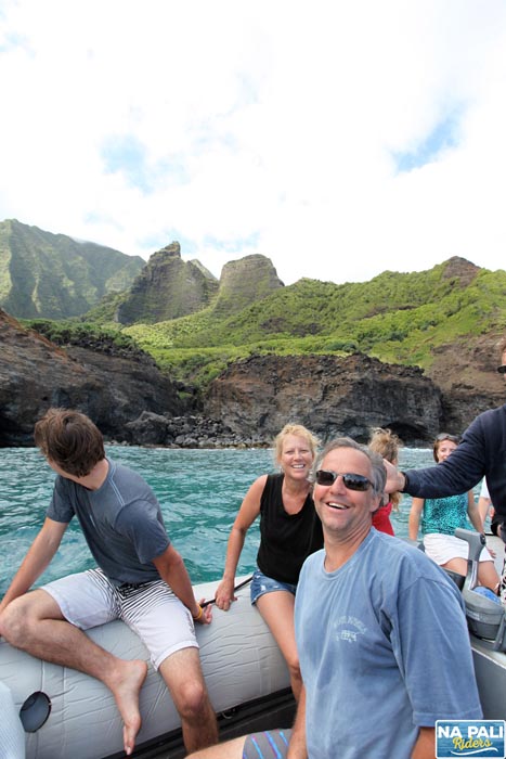 a group of people sitting on top of a mountain
