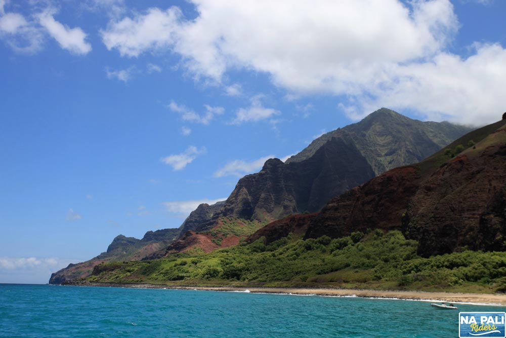 a body of water with a mountain in the background