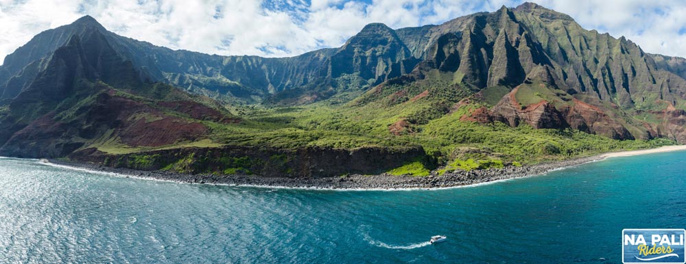 an island with a mountain in the background