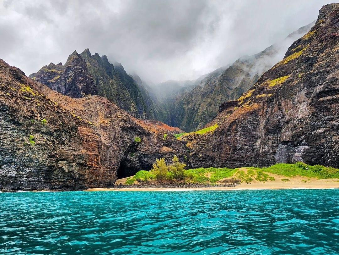 a body of water with a mountain in the background